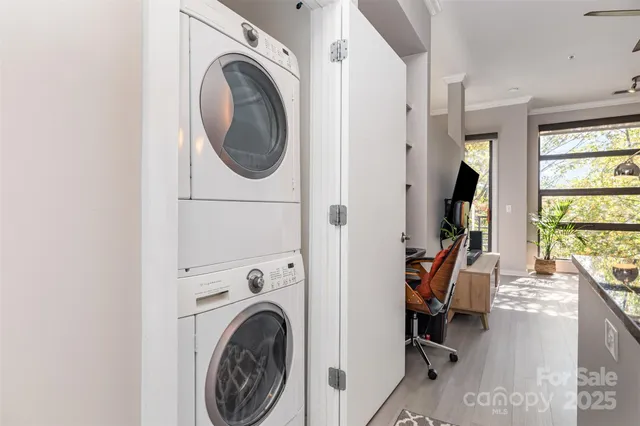 a view of a storage and utility room with a washer and dryer