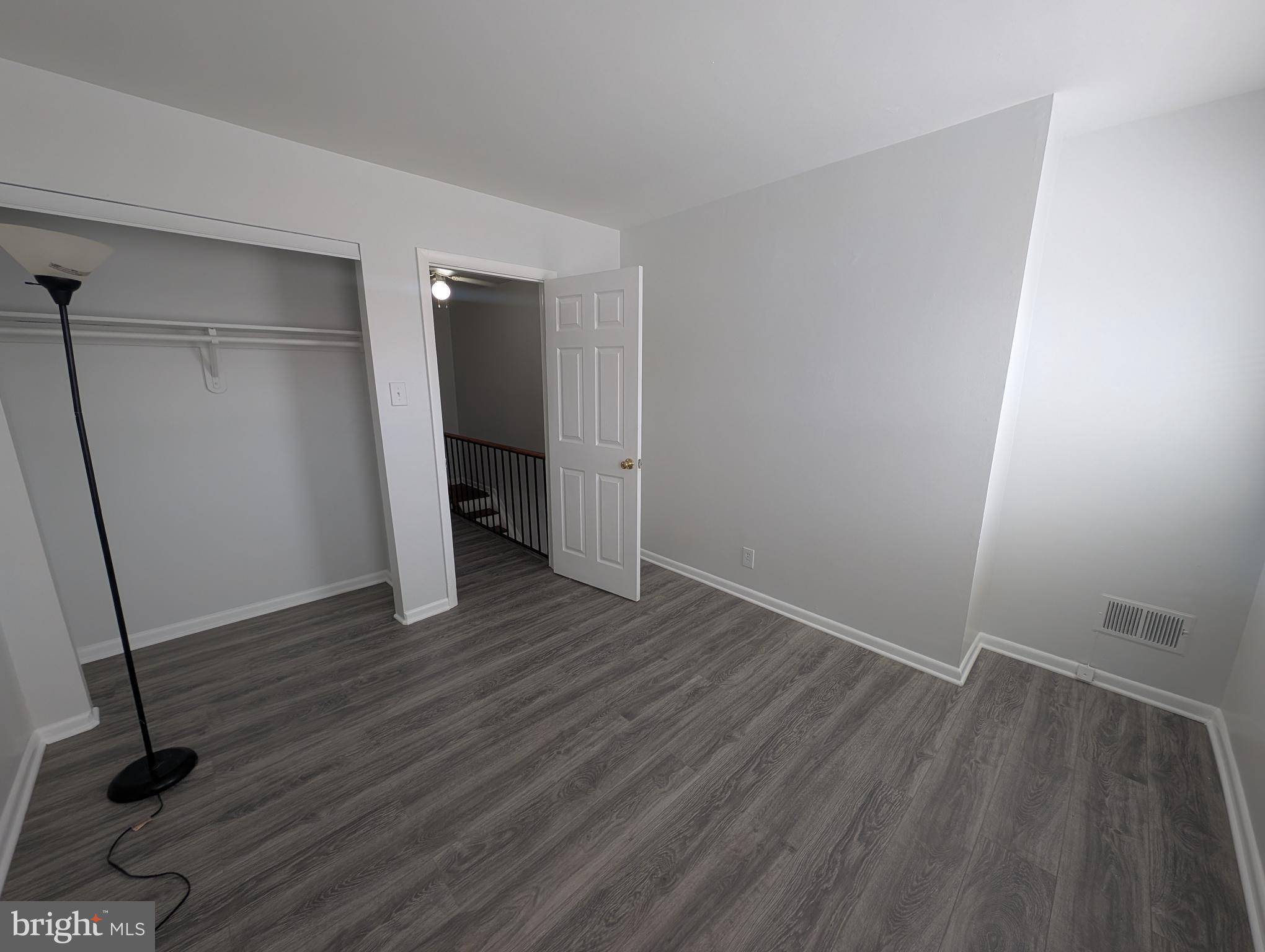 837 North Central Avenue Baltimore, MD 21202 - Photo 21 of 25 a view of an empty room with wooden floor