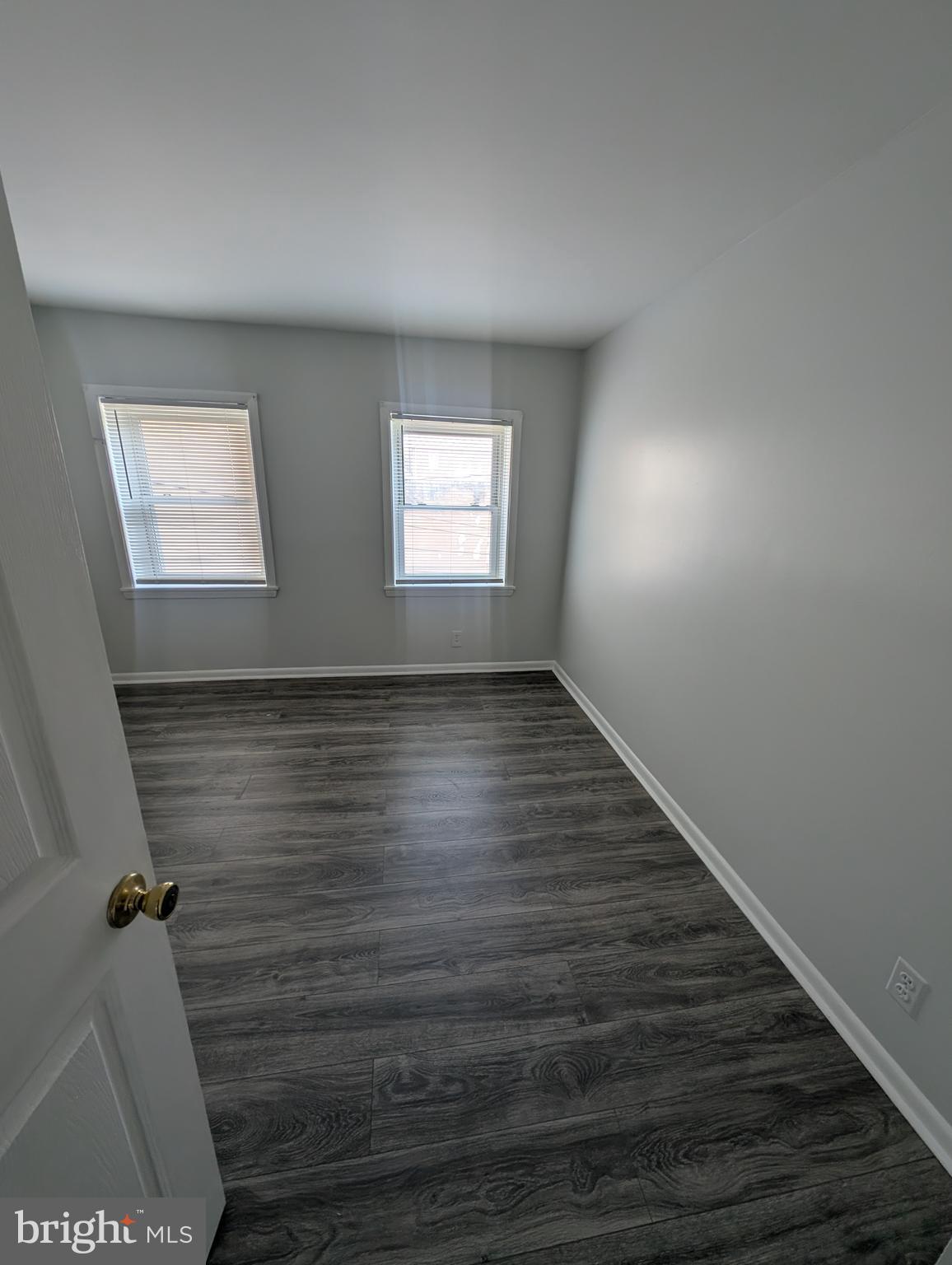 837 North Central Avenue Baltimore, MD 21202 - Photo 23 of 25 a view of room with window and wooden floor