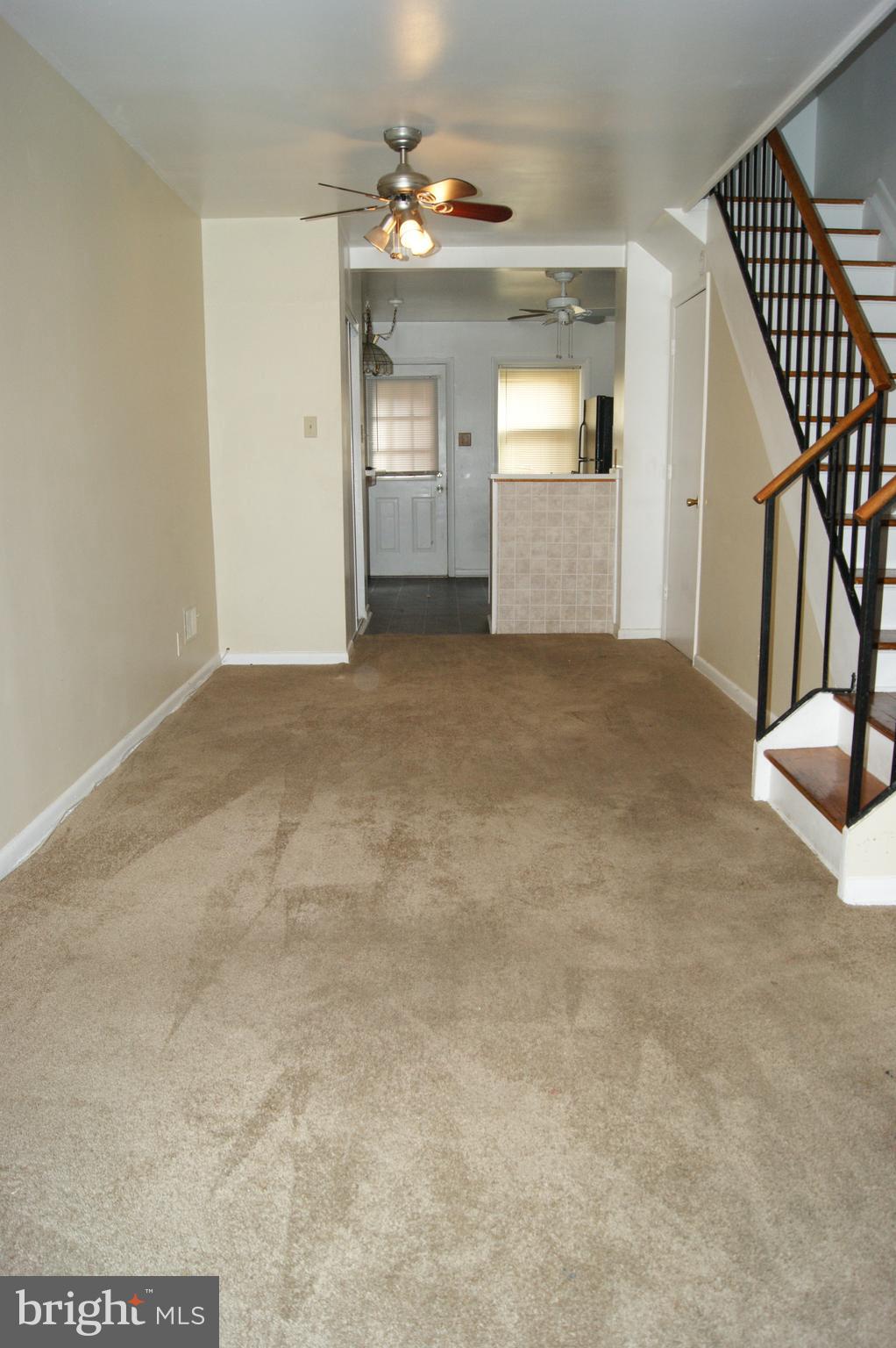 837 North Central Avenue Baltimore, MD 21202 - Photo 3 of 25 a view of a livingroom with a staircase