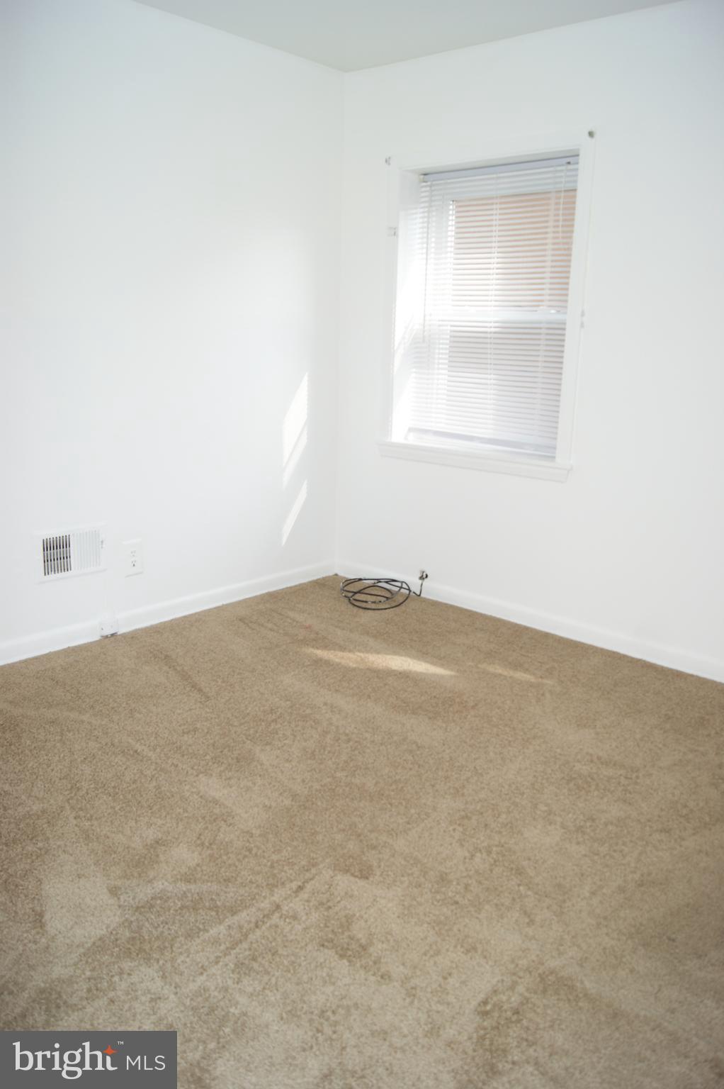837 North Central Avenue Baltimore, MD 21202 - Photo 7 of 25 an empty room with a window