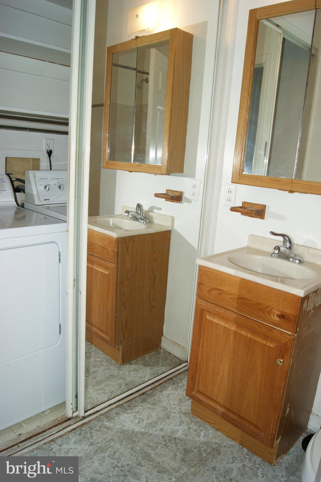 837 North Central Avenue Baltimore, MD 21202 - Photo 9 of 25 a bathroom with a sink and a mirror