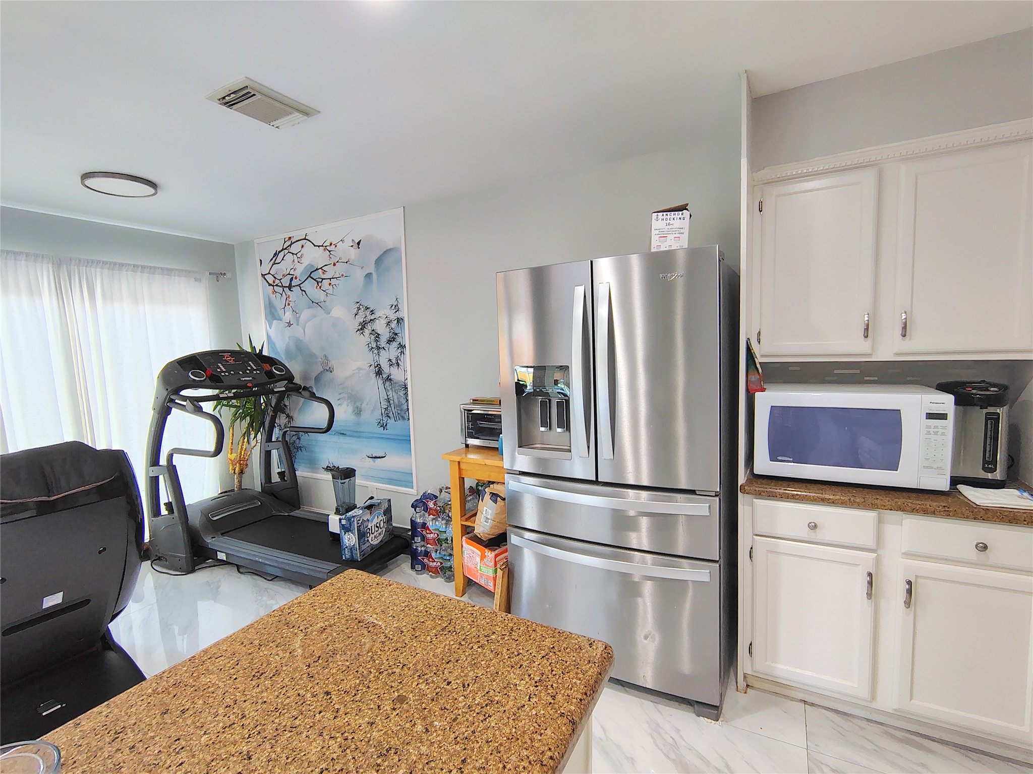 4411 Waterfall Way Sugar Land, TX 77479 - Photo 12 of 36 a kitchen with refrigerator and cabinets