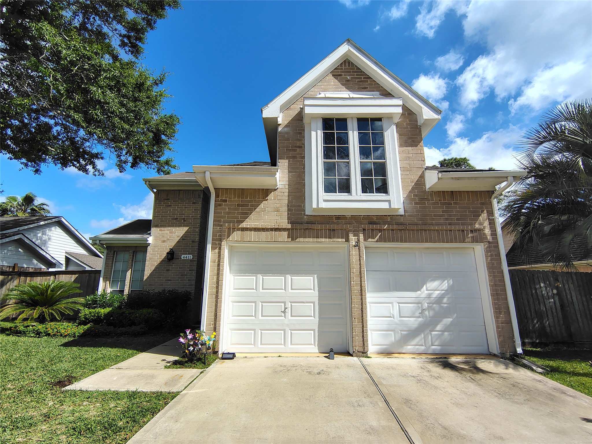 4411 Waterfall Way Sugar Land, TX 77479 - Photo 2 of 36 a front view of a house with a yard