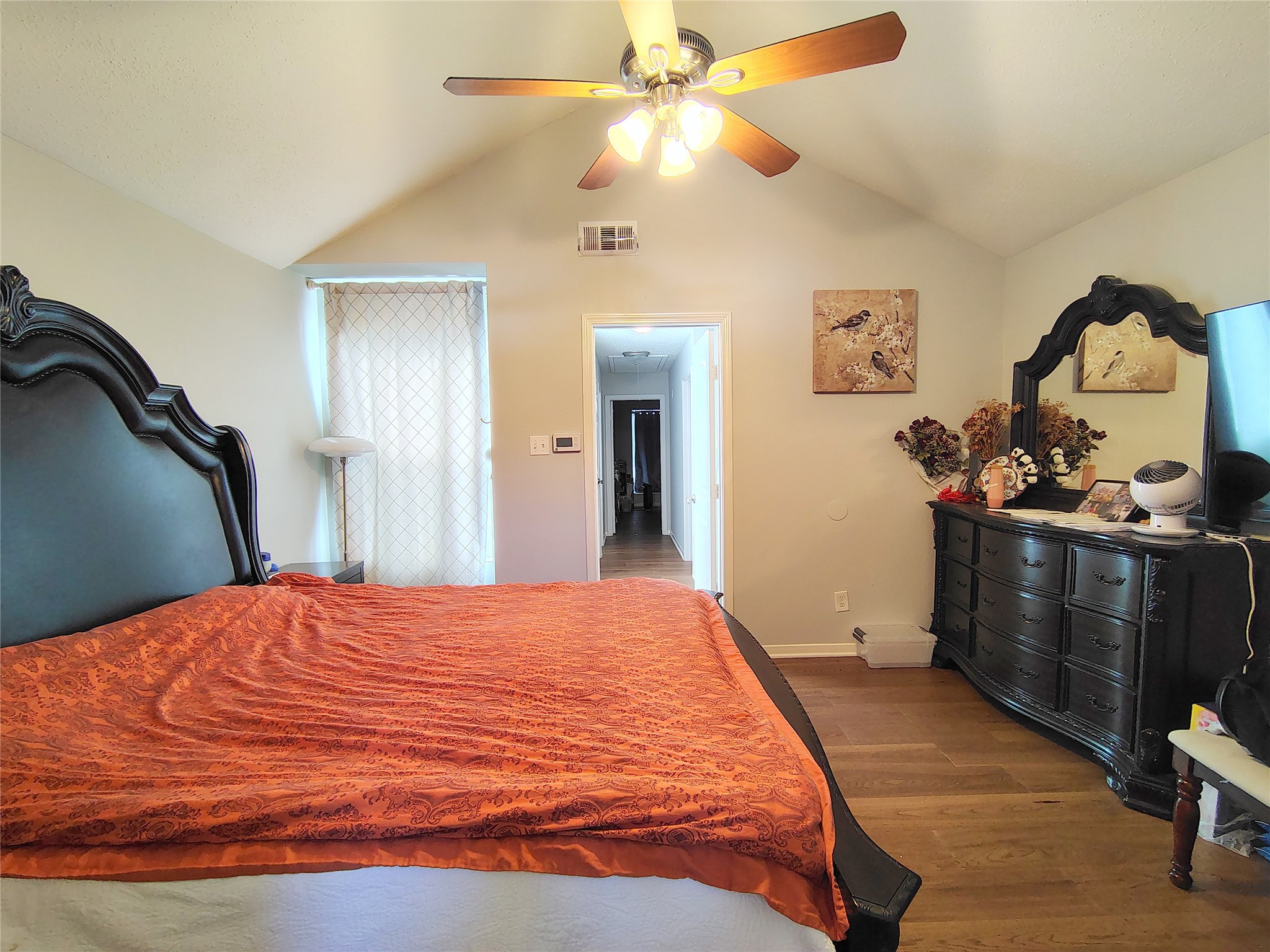 4411 Waterfall Way Sugar Land, TX 77479 - Photo 23 of 36 a bedroom with a bed and a chandelier