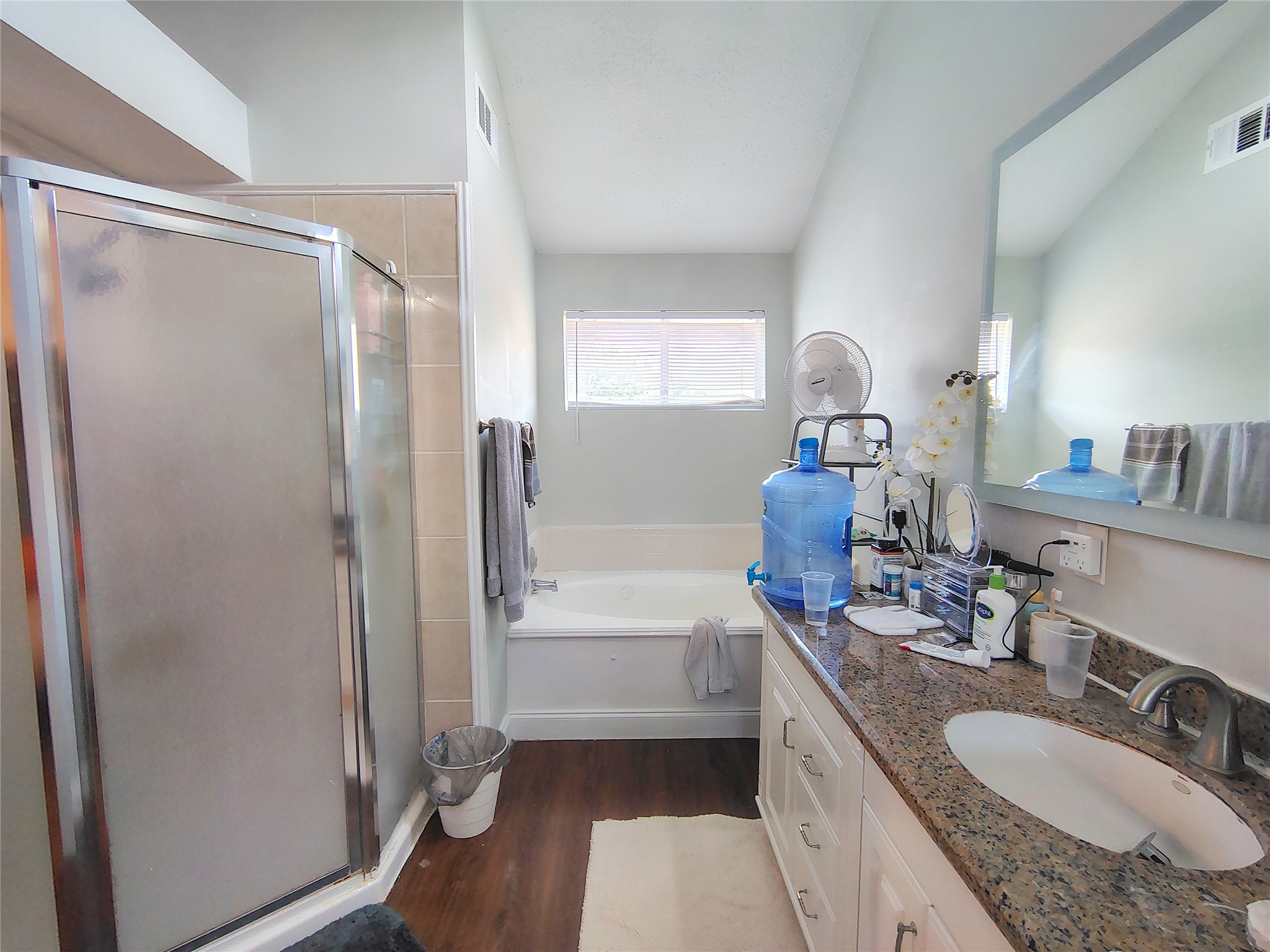4411 Waterfall Way Sugar Land, TX 77479 - Photo 24 of 36 a bathroom with a granite countertop sink mirror and a bathtub
