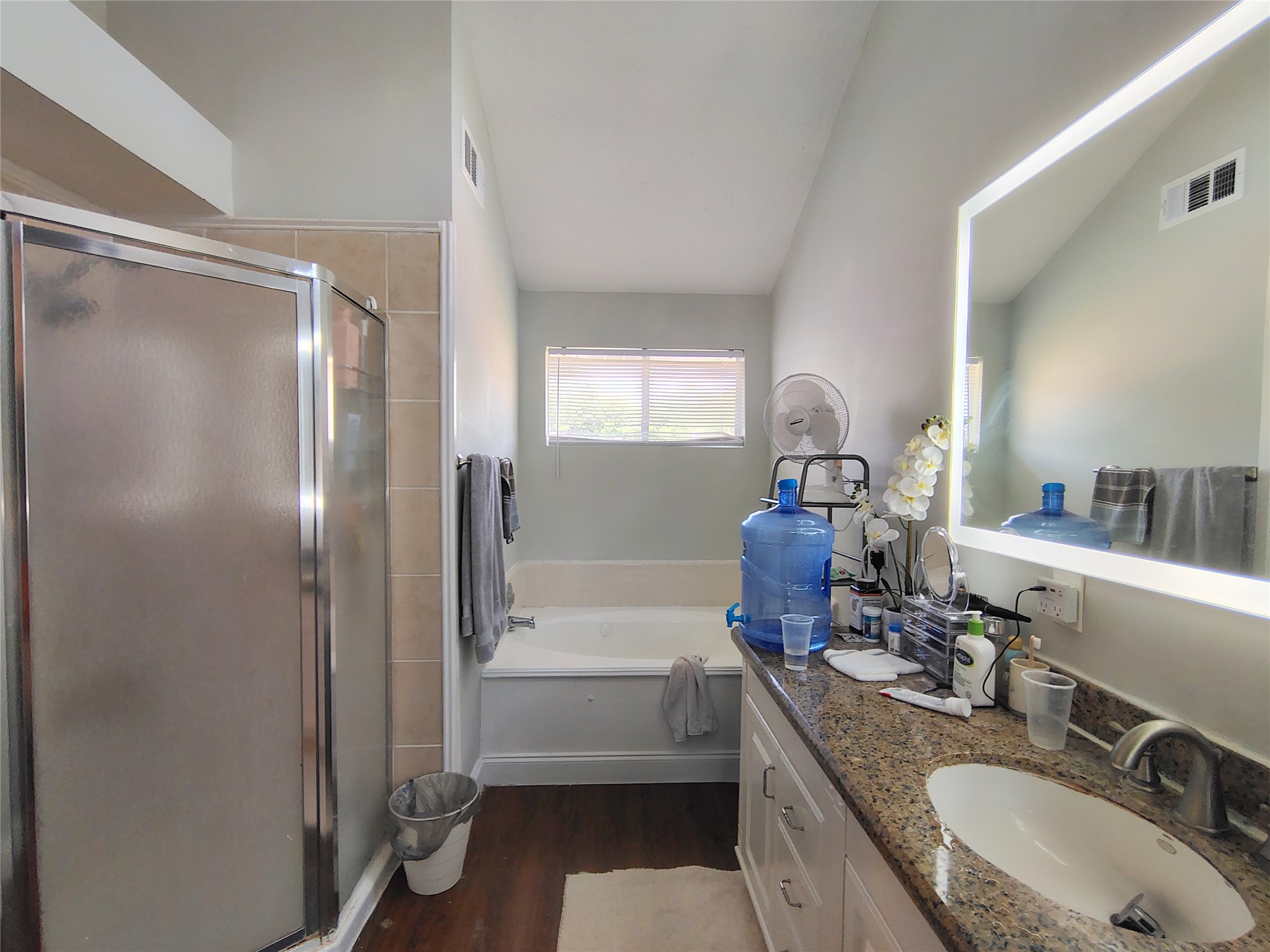 4411 Waterfall Way Sugar Land, TX 77479 - Photo 26 of 36 a bathroom with a granite countertop sink a mirror and a bathtub