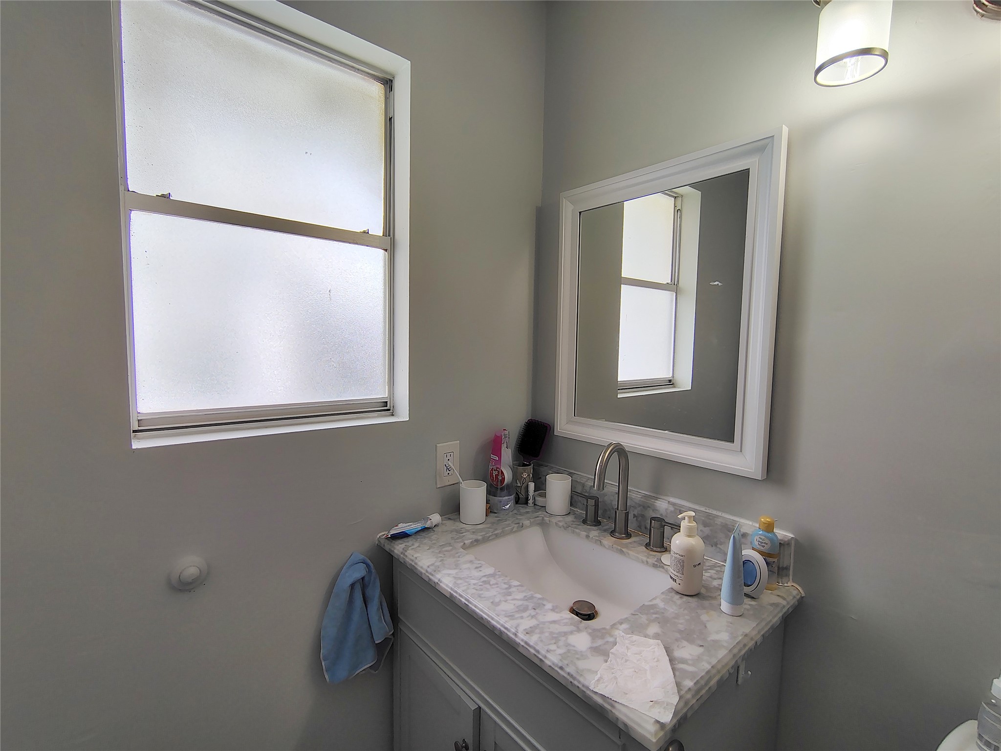 4411 Waterfall Way Sugar Land, TX 77479 - Photo 29 of 36 a bathroom with a sink and a mirror