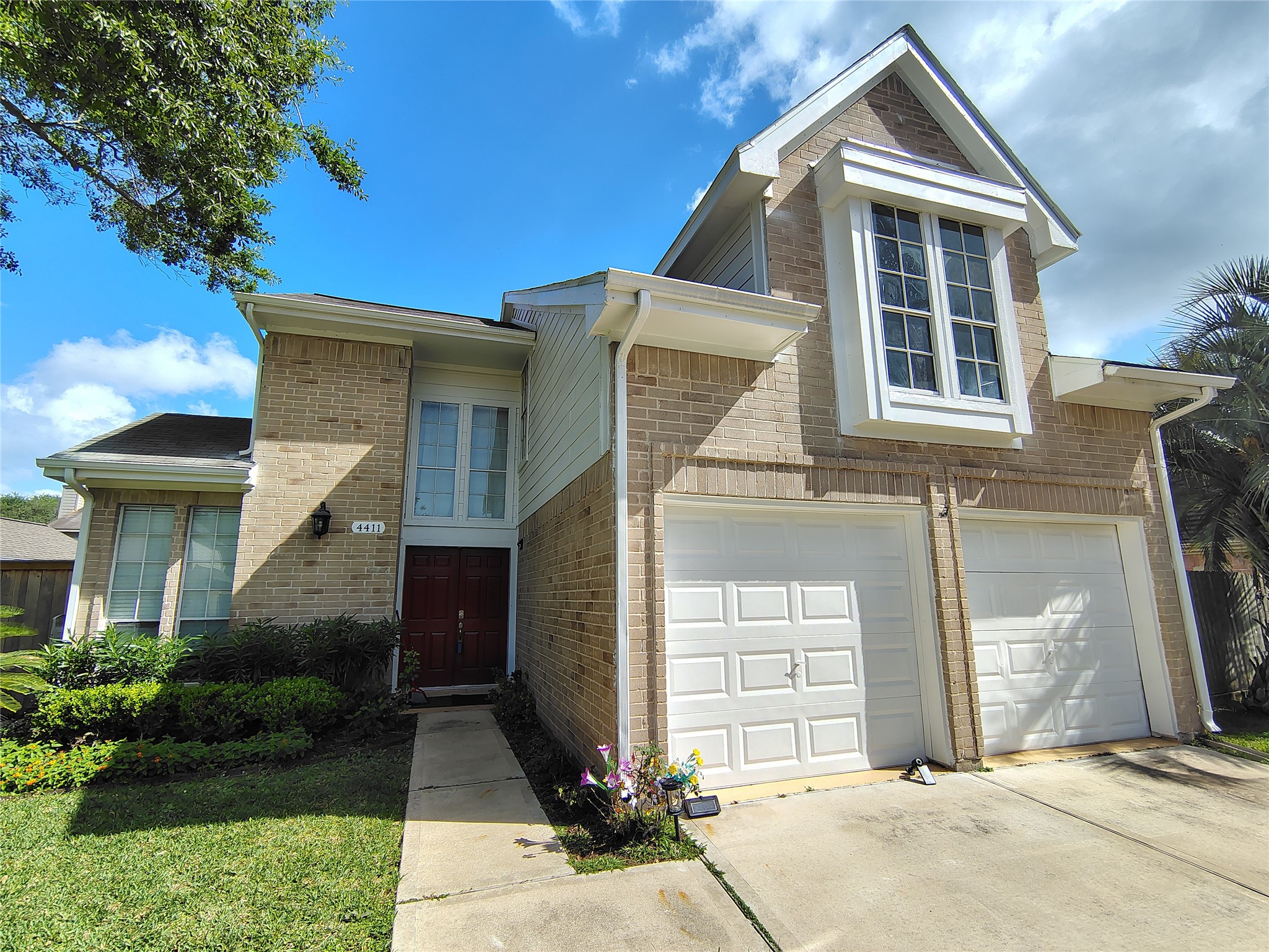 4411 Waterfall Way Sugar Land, TX 77479 - Photo 3 of 36 a front view of a house with a yard