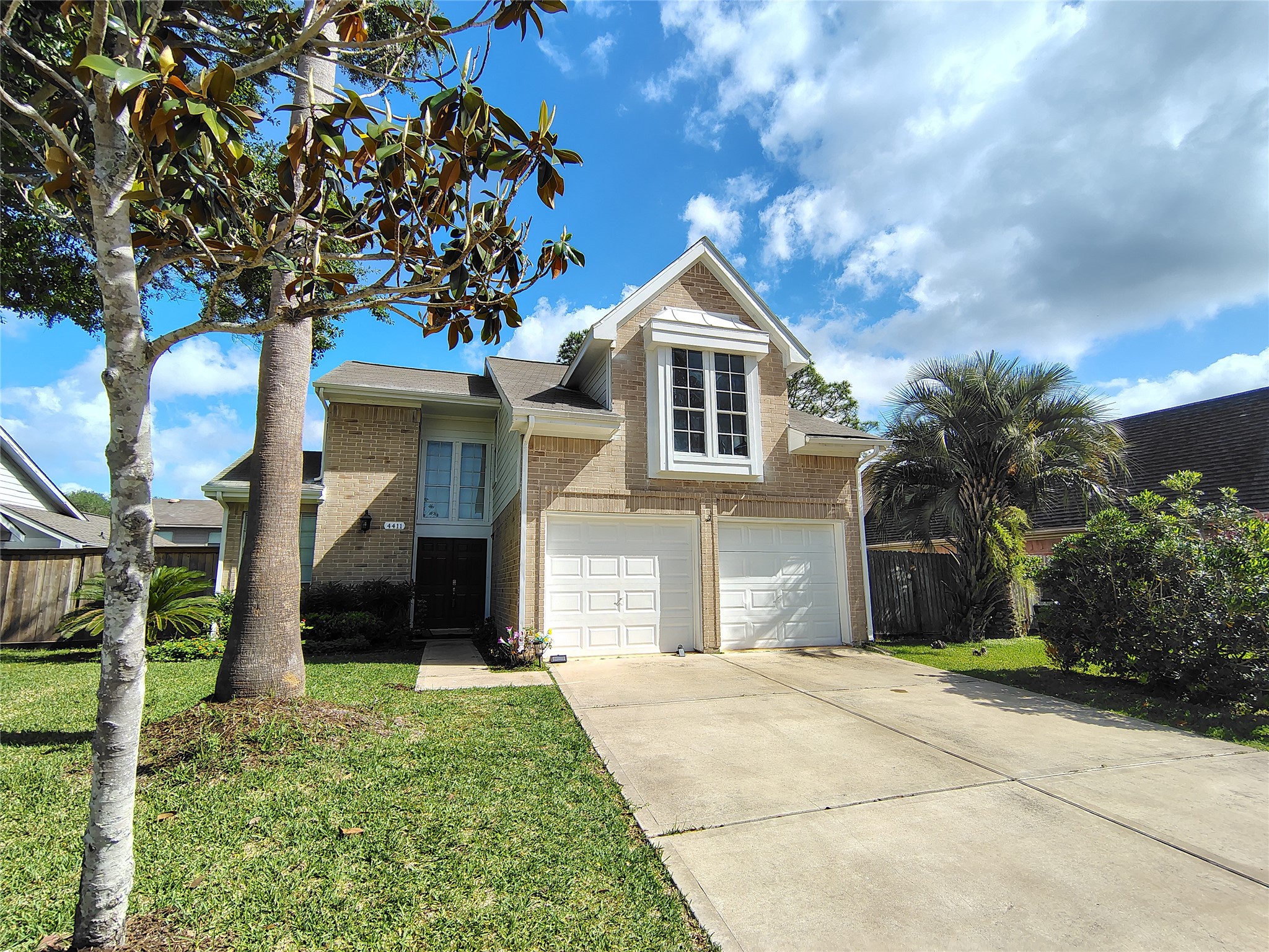 4411 Waterfall Way Sugar Land, TX 77479 - Photo 34 of 36 a front view of a house with garden