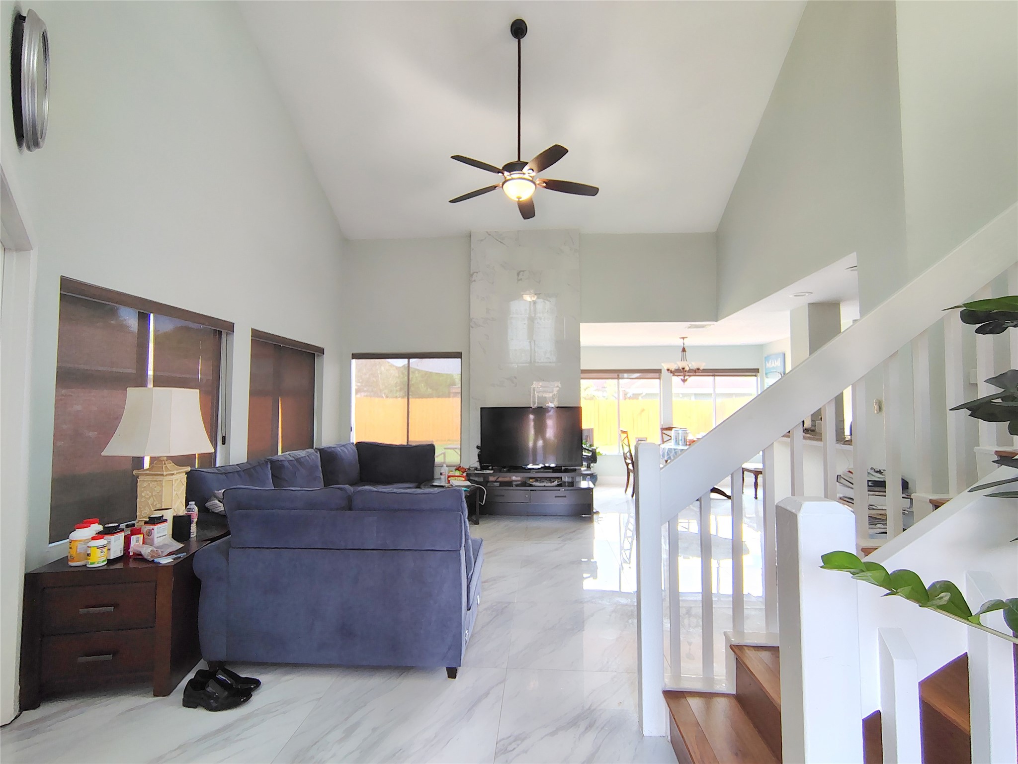4411 Waterfall Way Sugar Land, TX 77479 - Photo 4 of 36 a living room with furniture and a chandelier
