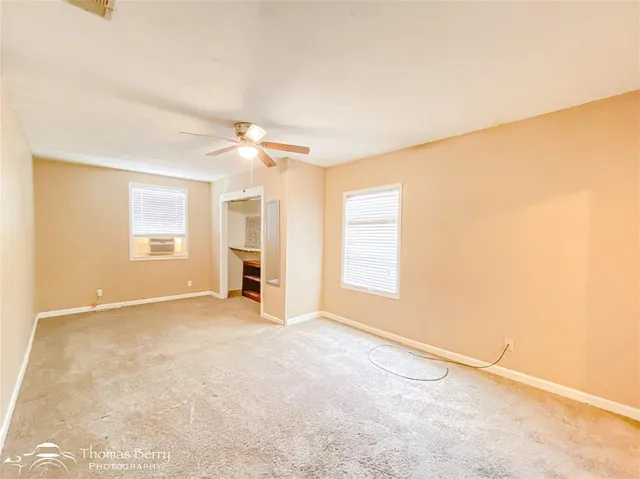 a view of an empty room with a window