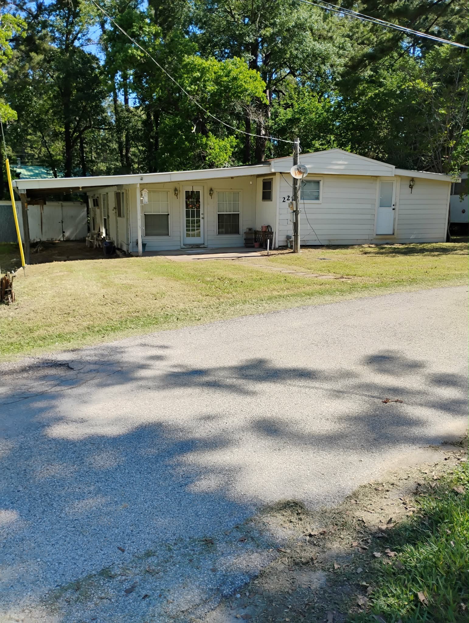 220 Ramp Way Trinity, TX 75862 - Photo 1 of 8 a view of a house with a swimming pool