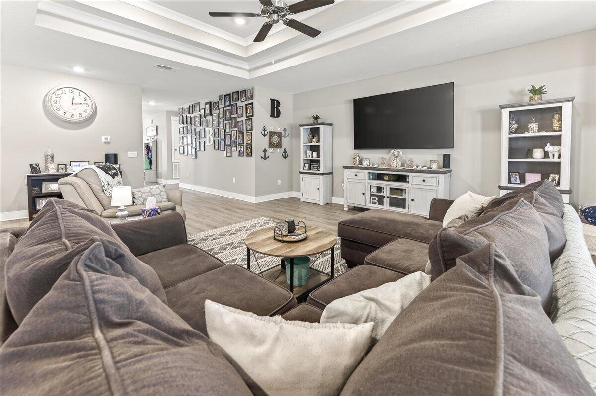 2455 Dakota Way Crestview, FL 32536 - Photo 24 of 81 a living room with furniture and a flat screen tv