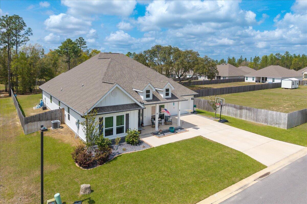 2455 Dakota Way Crestview, FL 32536 - Photo 4 of 81 a view of a house with swimming pool and sitting area