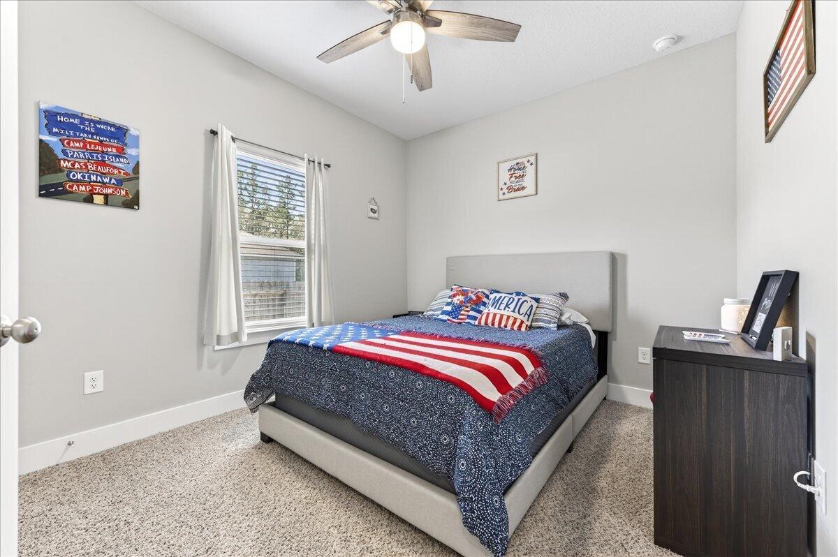 2455 Dakota Way Crestview, FL 32536 - Photo 51 of 81 a bed sitting in a bedroom next to a window