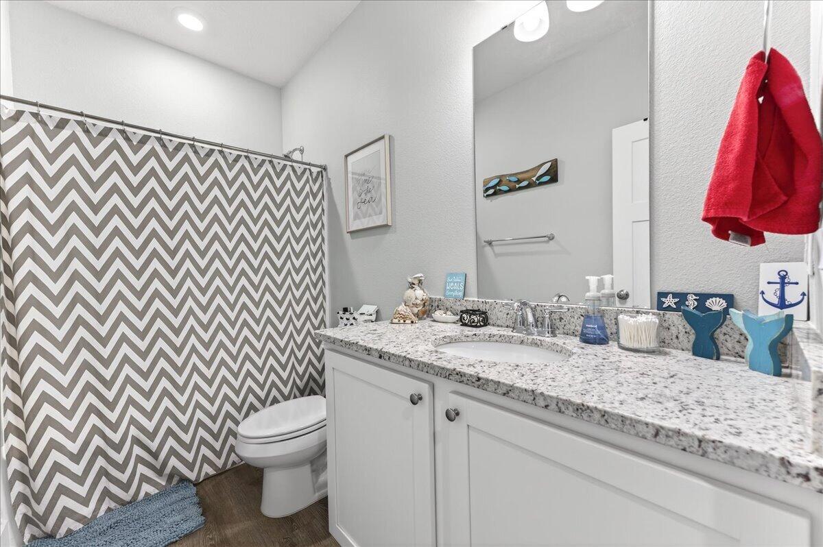 2455 Dakota Way Crestview, FL 32536 - Photo 53 of 81 a bathroom with a granite countertop sink and a toilet