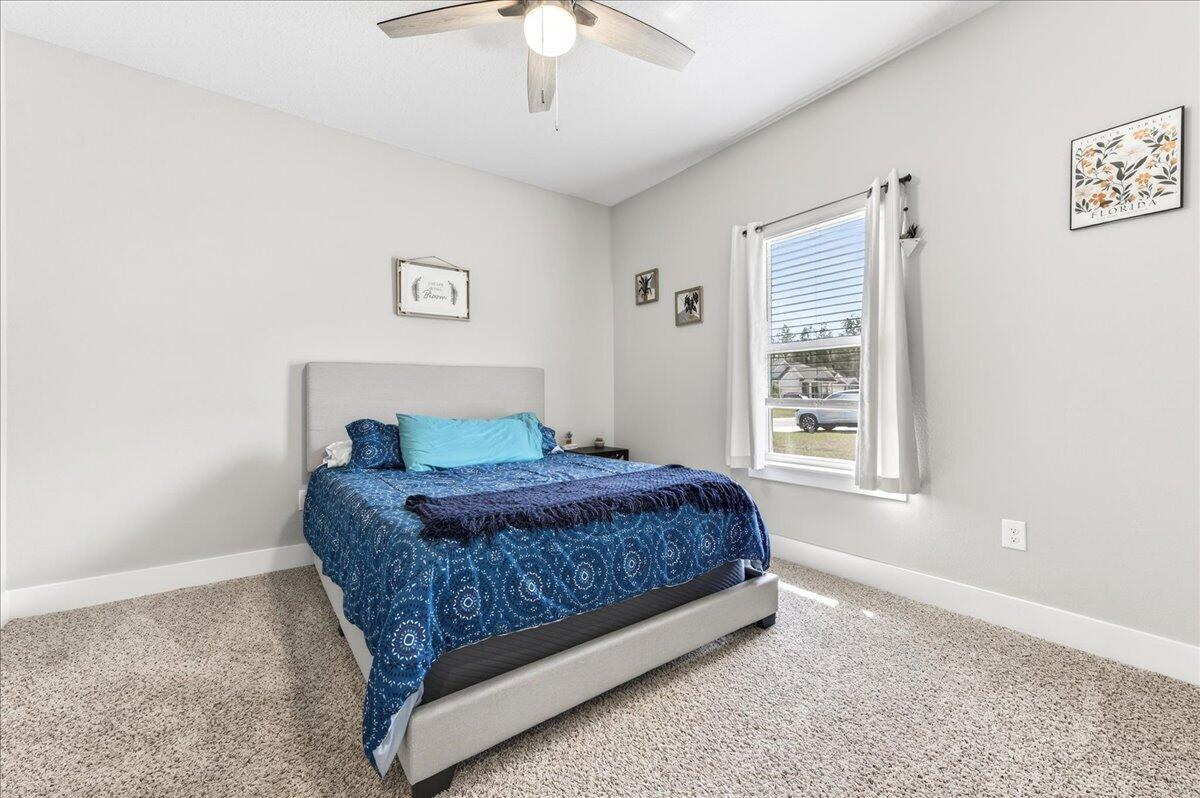 2455 Dakota Way Crestview, FL 32536 - Photo 55 of 81 a bedroom with a bed and a window