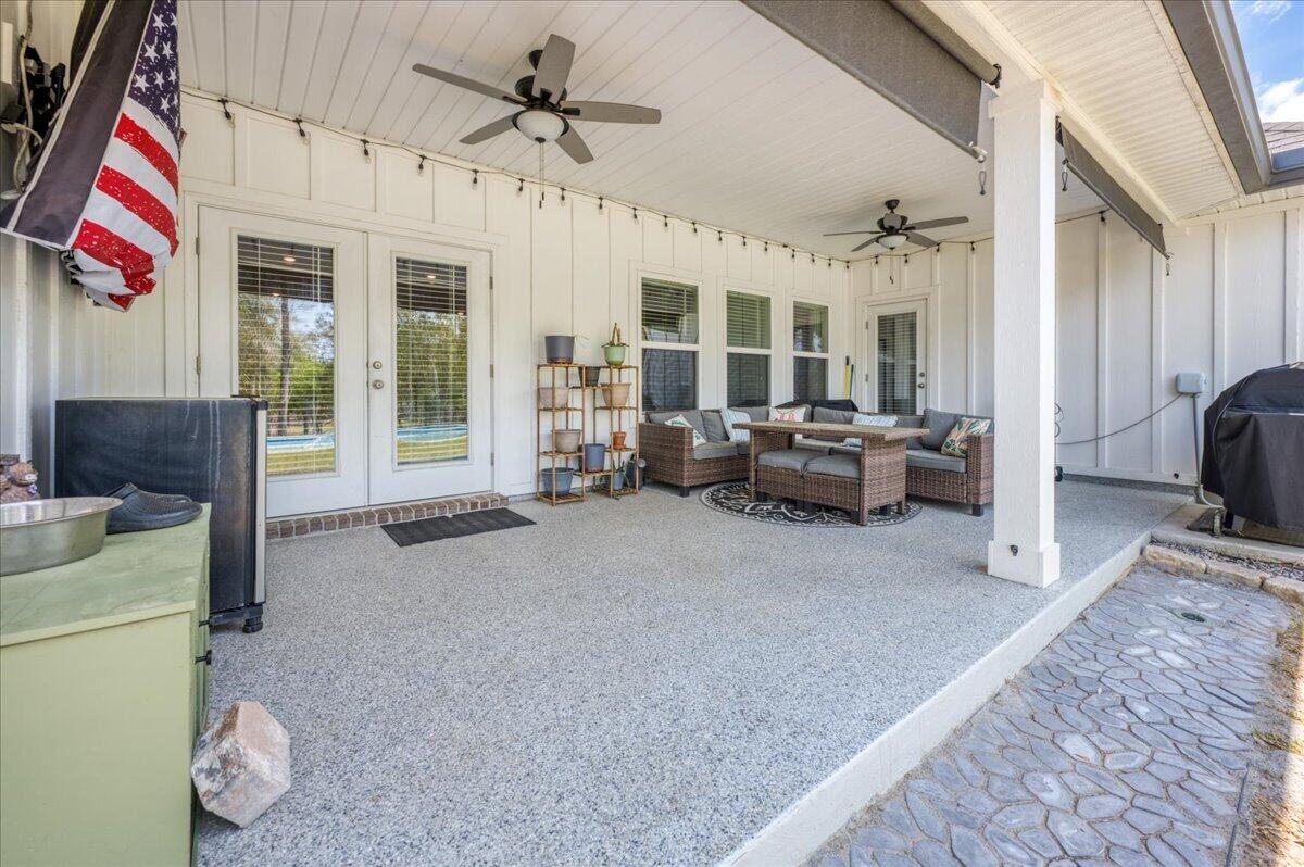 2455 Dakota Way Crestview, FL 32536 - Photo 59 of 81 a living room with furniture and a flat screen tv