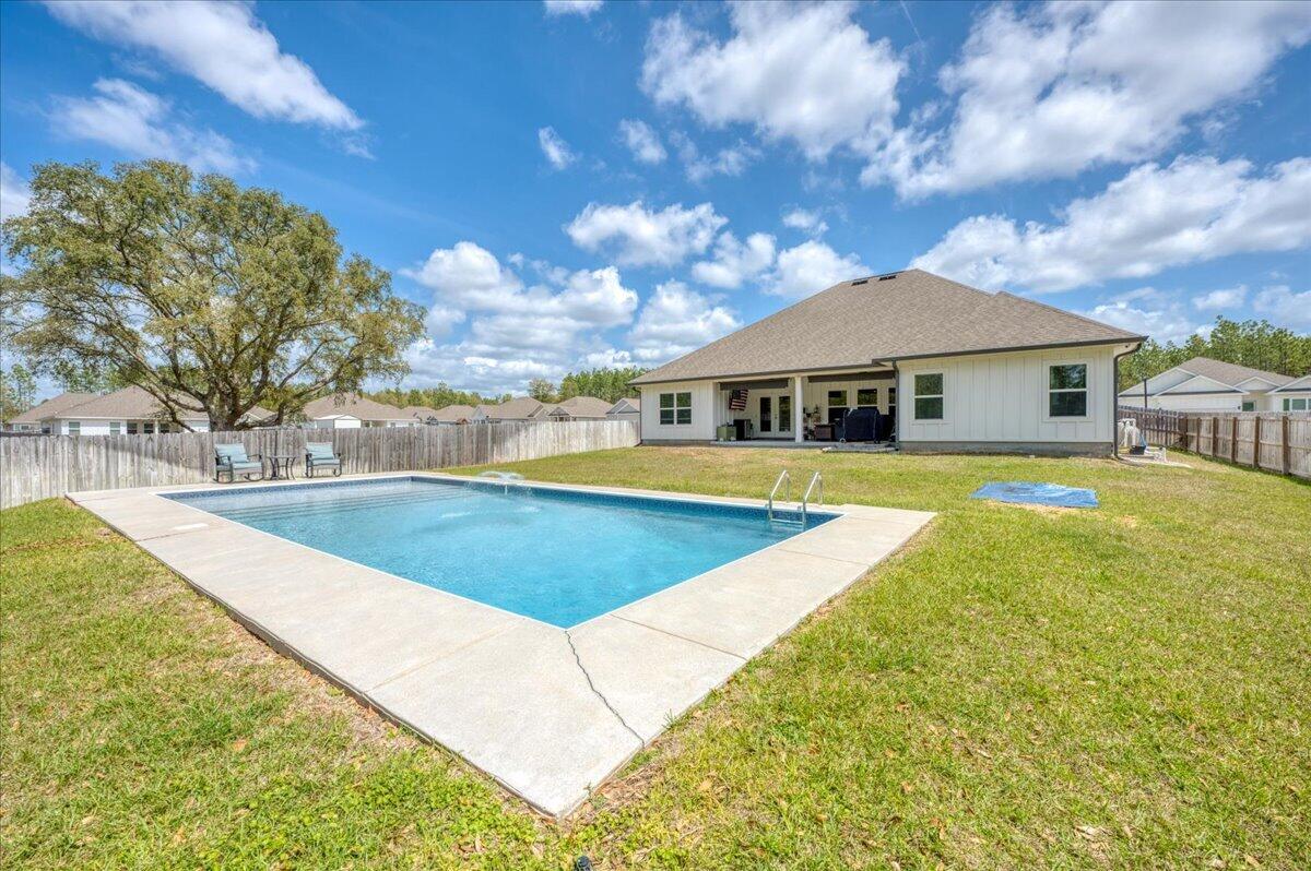 2455 Dakota Way Crestview, FL 32536 - Photo 65 of 81 a view of a house with swimming pool and sitting area