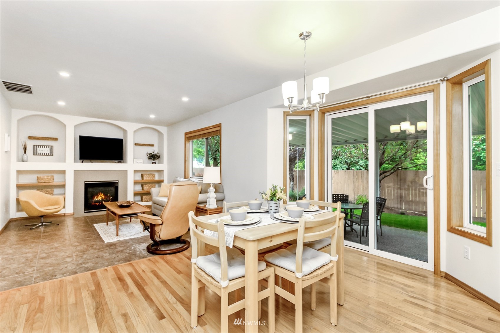 25815 176th Place Southeast Covington, WA 98042 - Photo 19 of 36 a view of a dining room with furniture window and wooden floor