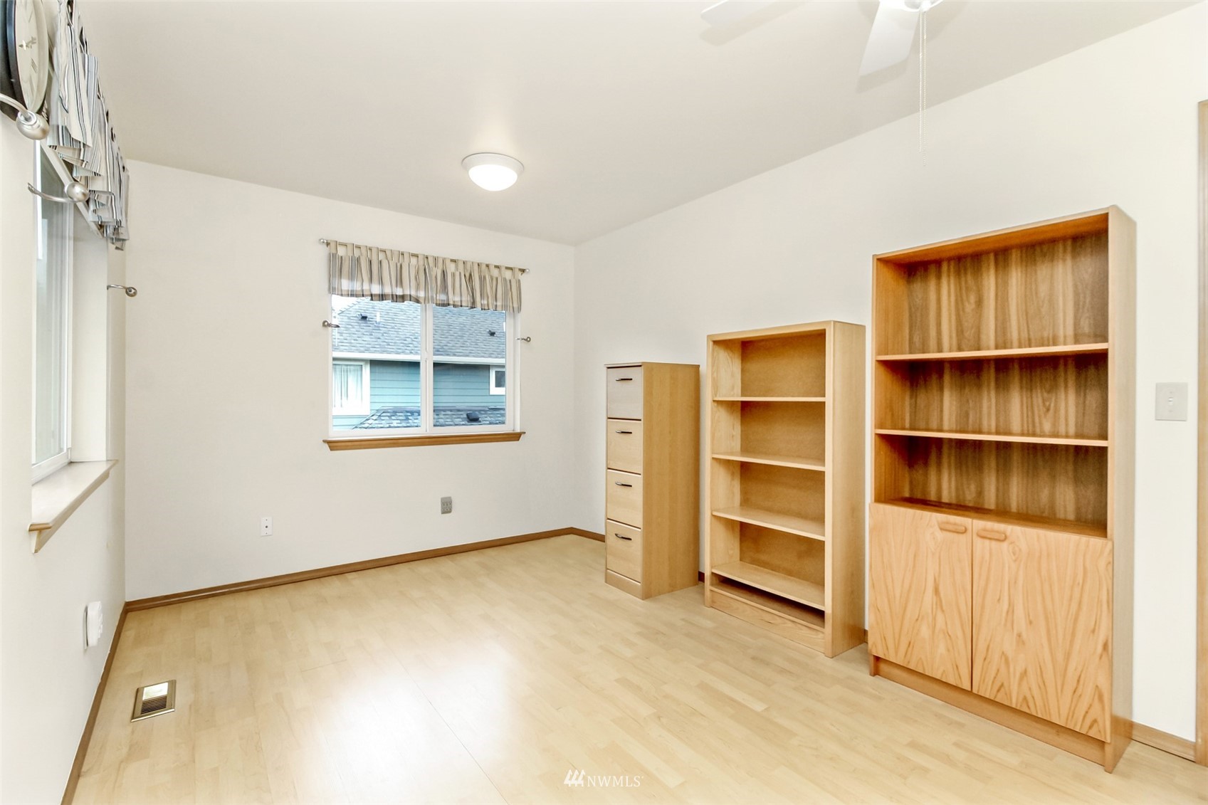 25815 176th Place Southeast Covington, WA 98042 - Photo 28 of 36 a view of an empty room with cabinet and a window
