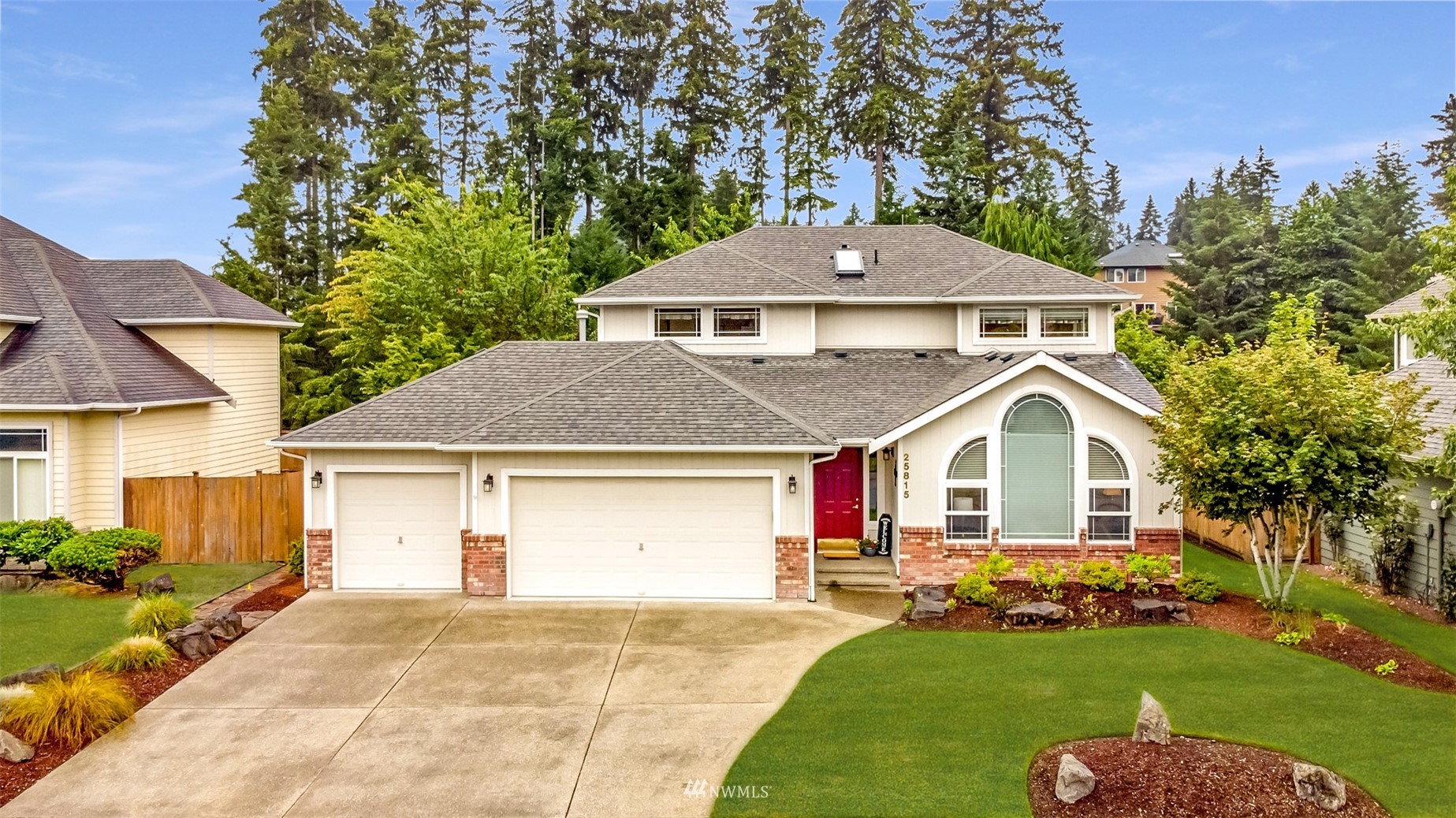 25815 176th Place Southeast Covington, WA 98042 - Photo 5 of 36 a front view of a house with a garden