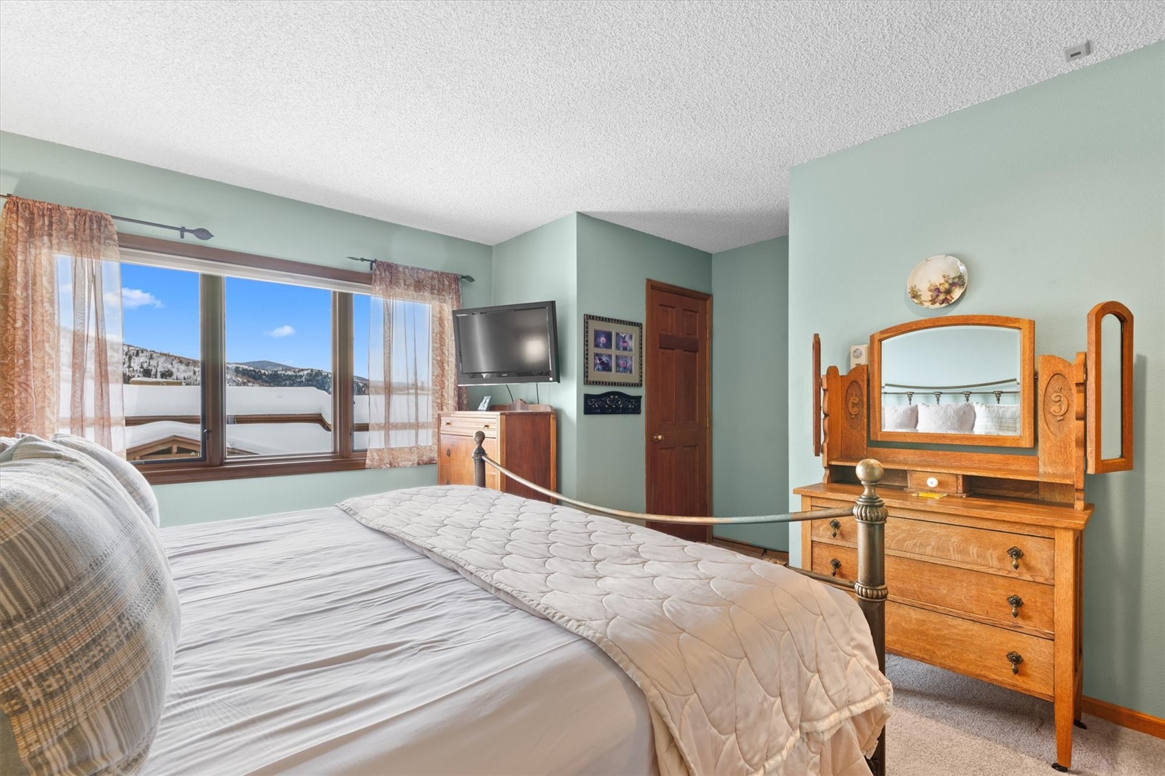 1655 Ranch Road, Unit 402 Steamboat Springs, CO 80487 - Photo 23 of 30 Primary Bedroom with Large Window View