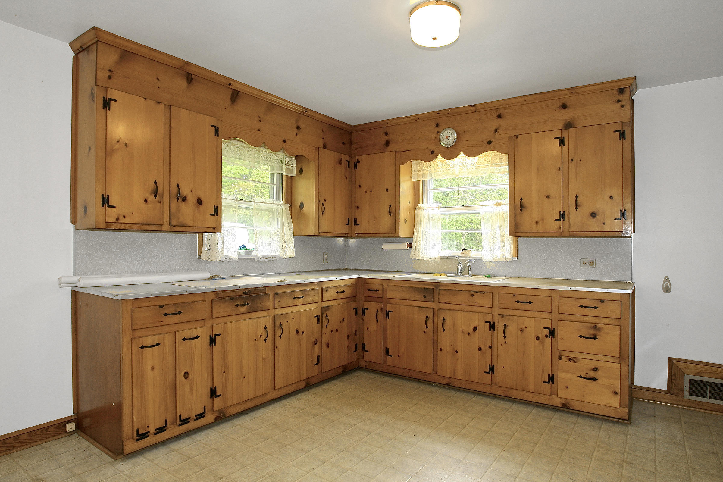 1058 Silverleaf Road Southeast Floyd, VA 24091 - Photo 21 of 55 a kitchen with granite countertop wooden cabinets a sink and a window