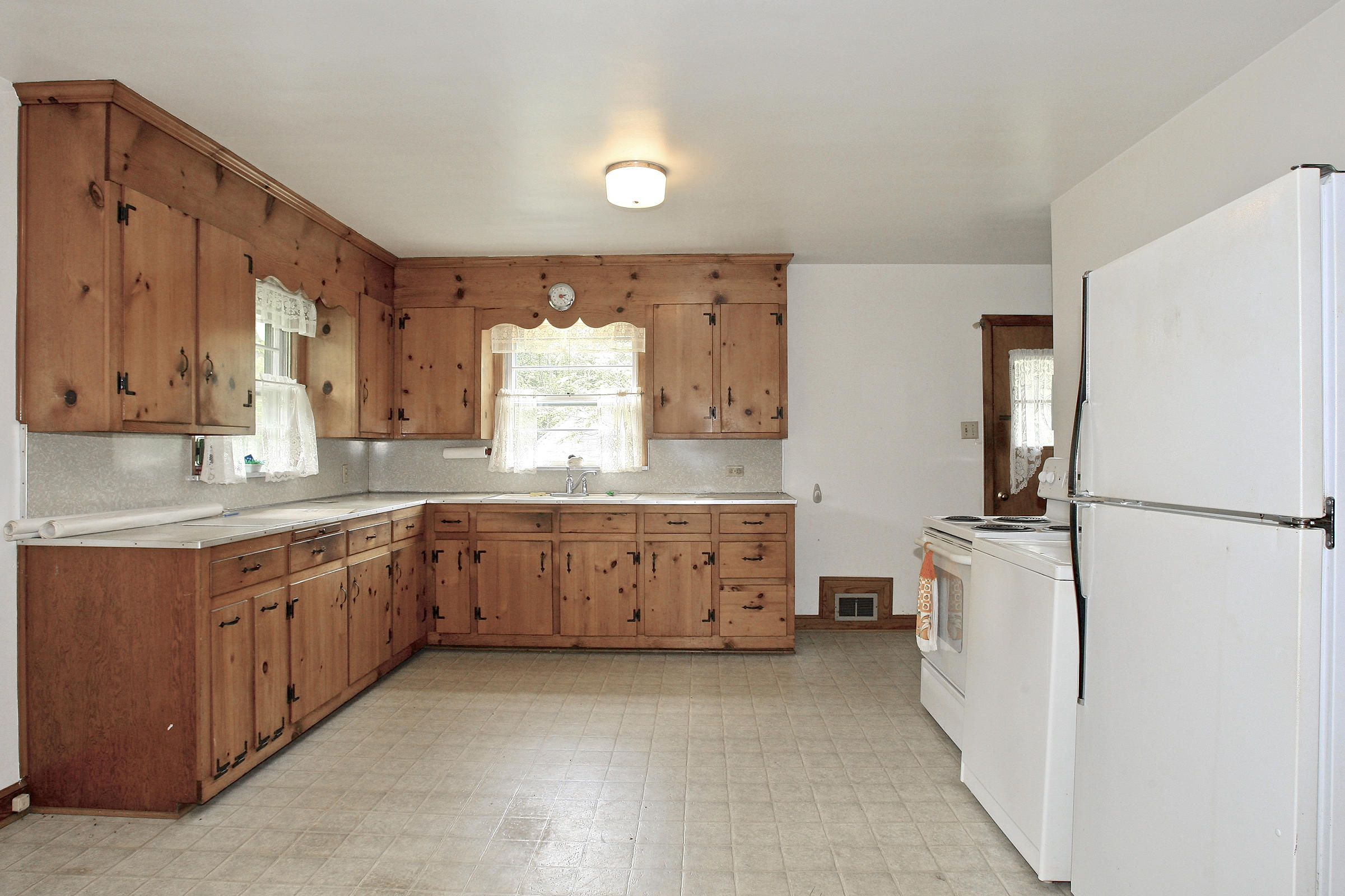 1058 Silverleaf Road Southeast Floyd, VA 24091 - Photo 25 of 55 a kitchen with granite countertop a refrigerator and a sink