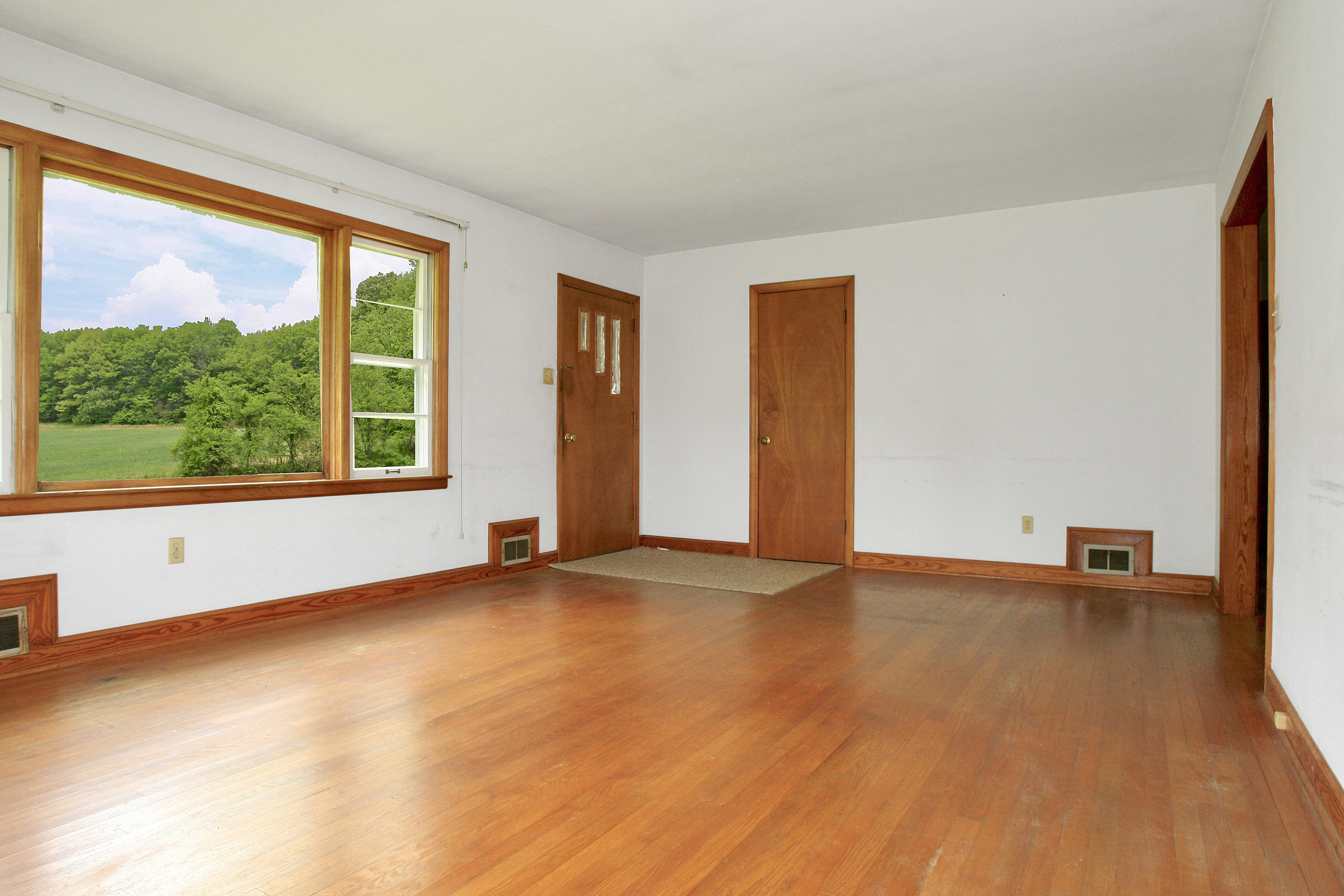 1058 Silverleaf Road Southeast Floyd, VA 24091 - Photo 8 of 55 wooden floor in an empty room with a window