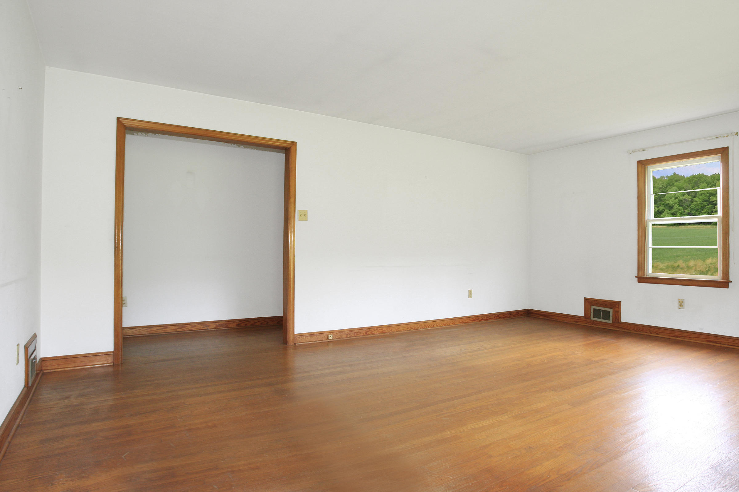 1058 Silverleaf Road Southeast Floyd, VA 24091 - Photo 10 of 55 an empty room with wooden floor and windows