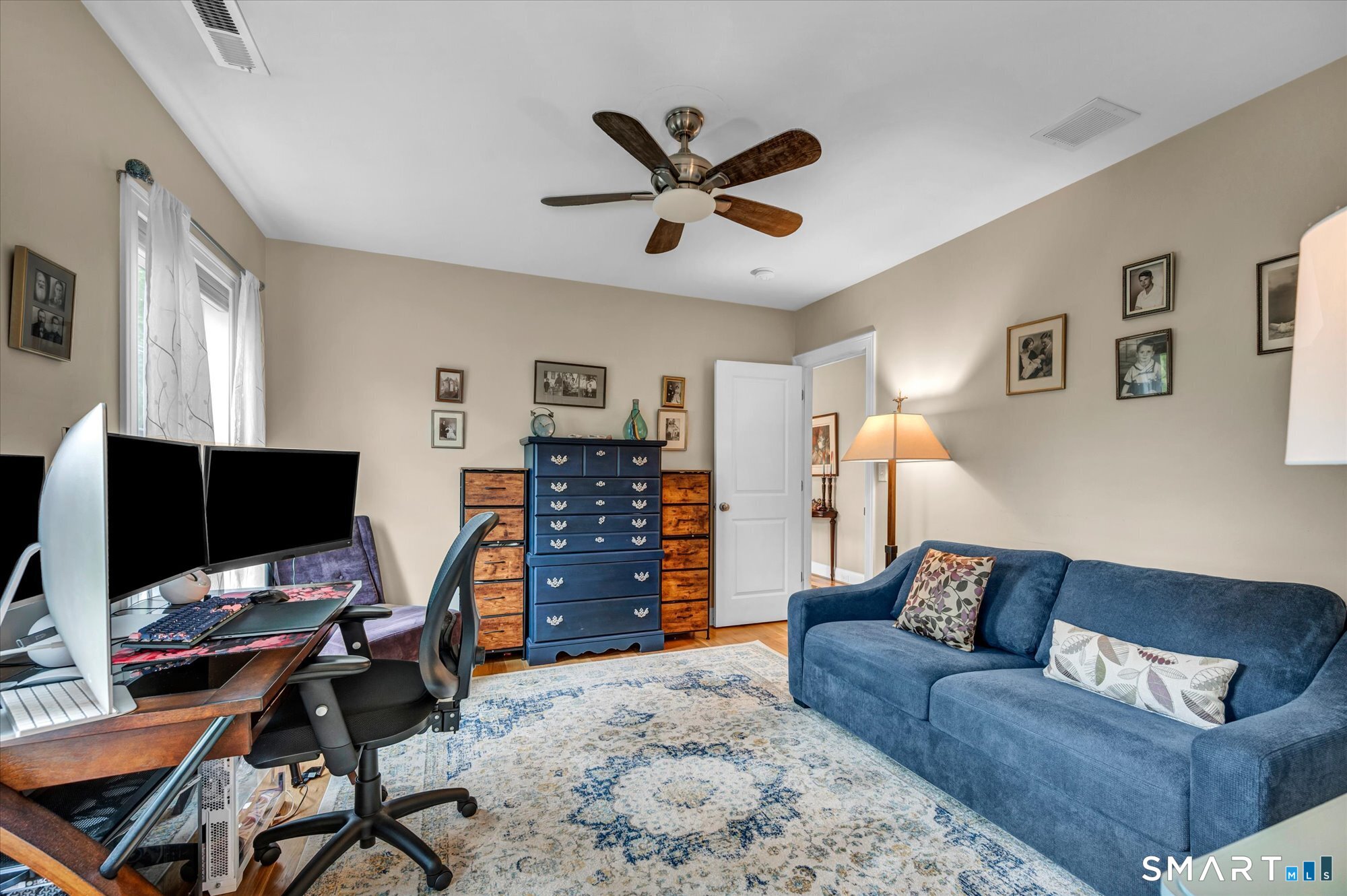 16 Sweetheart Mountain Road Canton, CT 06019 - Photo 26 of 40 a living room with furniture and a flat screen tv