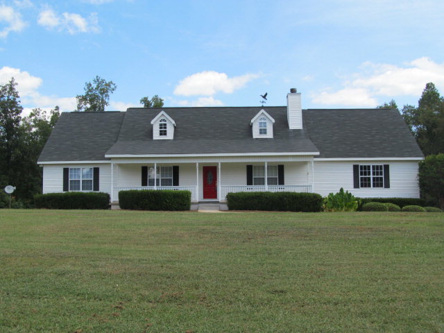 155 Girl Scout Road Lizella, GA 31052 - Photo 1 of 36 a front view of a house with a yard