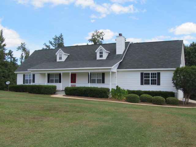 155 Girl Scout Road Lizella, GA 31052 - Photo 2 of 36 a front view of a house with garden