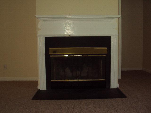 155 Girl Scout Road Lizella, GA 31052 - Photo 13 of 36 a living room with a fireplace