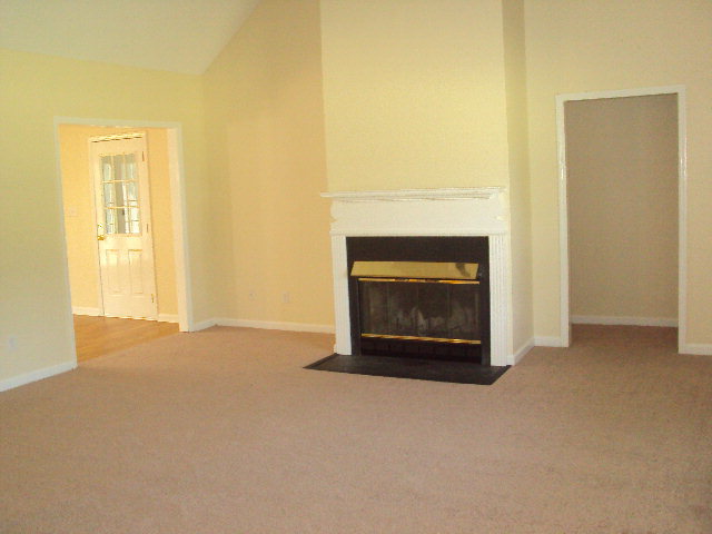 155 Girl Scout Road Lizella, GA 31052 - Photo 14 of 36 a living room with a fireplace