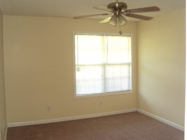 155 Girl Scout Road Lizella, GA 31052 - Photo 18 of 36 an empty room with a window and a fan