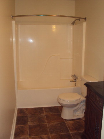 155 Girl Scout Road Lizella, GA 31052 - Photo 20 of 36 a bathroom with a shower and a toilet