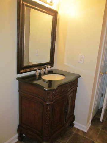 155 Girl Scout Road Lizella, GA 31052 - Photo 21 of 36 a sink sitting next to a bathroom sink