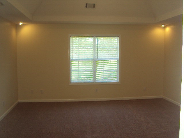 155 Girl Scout Road Lizella, GA 31052 - Photo 22 of 36 an empty room with a window