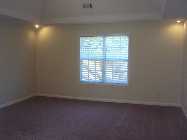155 Girl Scout Road Lizella, GA 31052 - Photo 23 of 36 an empty room with a window