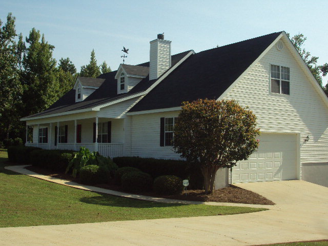 155 Girl Scout Road Lizella, GA 31052 - Photo 27 of 36 a front view of a house with garden
