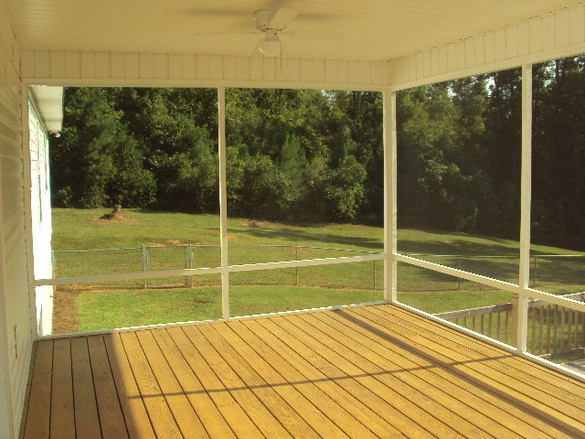 155 Girl Scout Road Lizella, GA 31052 - Photo 29 of 36 a view of a room with floor to ceiling windows