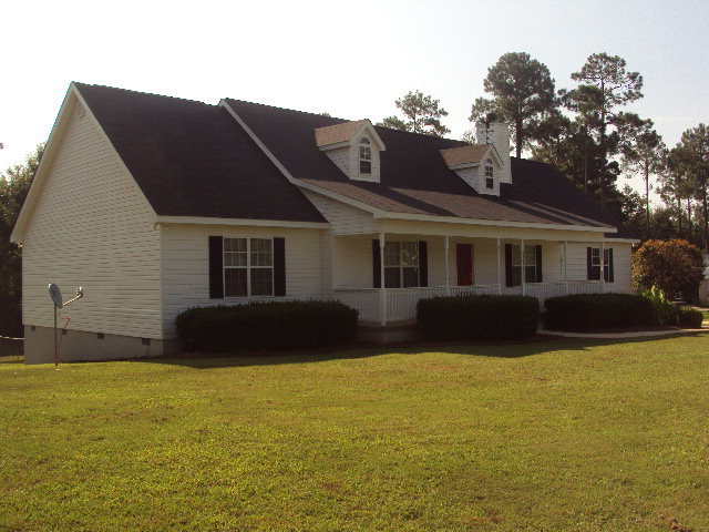 155 Girl Scout Road Lizella, GA 31052 - Photo 30 of 36 a view of house with a yard