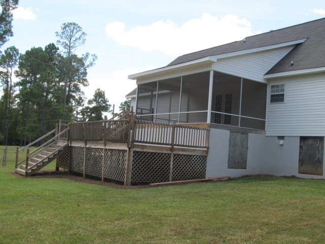 155 Girl Scout Road Lizella, GA 31052 - Photo 35 of 36 a view of a backyard with couches and a potted plant