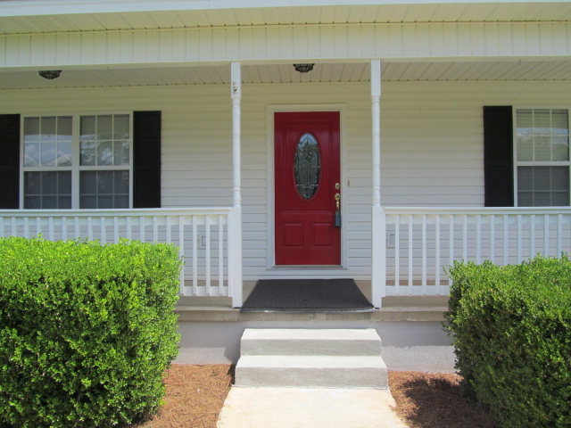 155 Girl Scout Road Lizella, GA 31052 - Photo 5 of 36 a front view of a house with garden