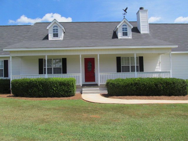155 Girl Scout Road Lizella, GA 31052 - Photo 6 of 36 a front view of a house with a yard