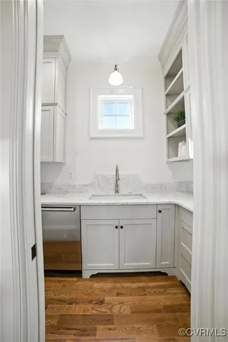 a bathroom with a sink granite and a vanity