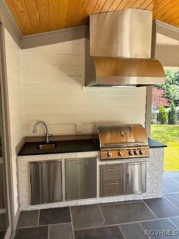 a stove top oven sitting inside of a kitchen